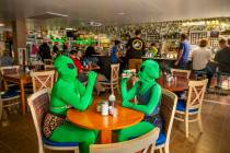 Invader Q-Tip, left, and Invader Stink enjoy a hot sauce breakfast at the Little A'Le'Inn Resta ...