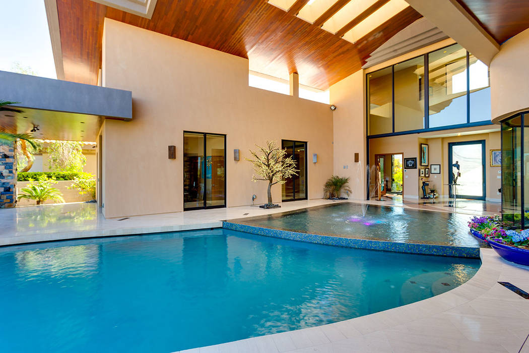 Ivan Sher Group Rick Sender designed the pool to nearly flow into the home.