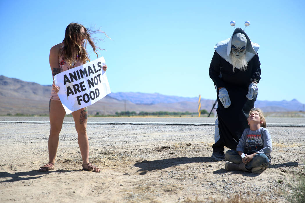 Animal rights activist Frankie Schoen of Philadelphia, from left, looks on as Jess Barrios of L ...