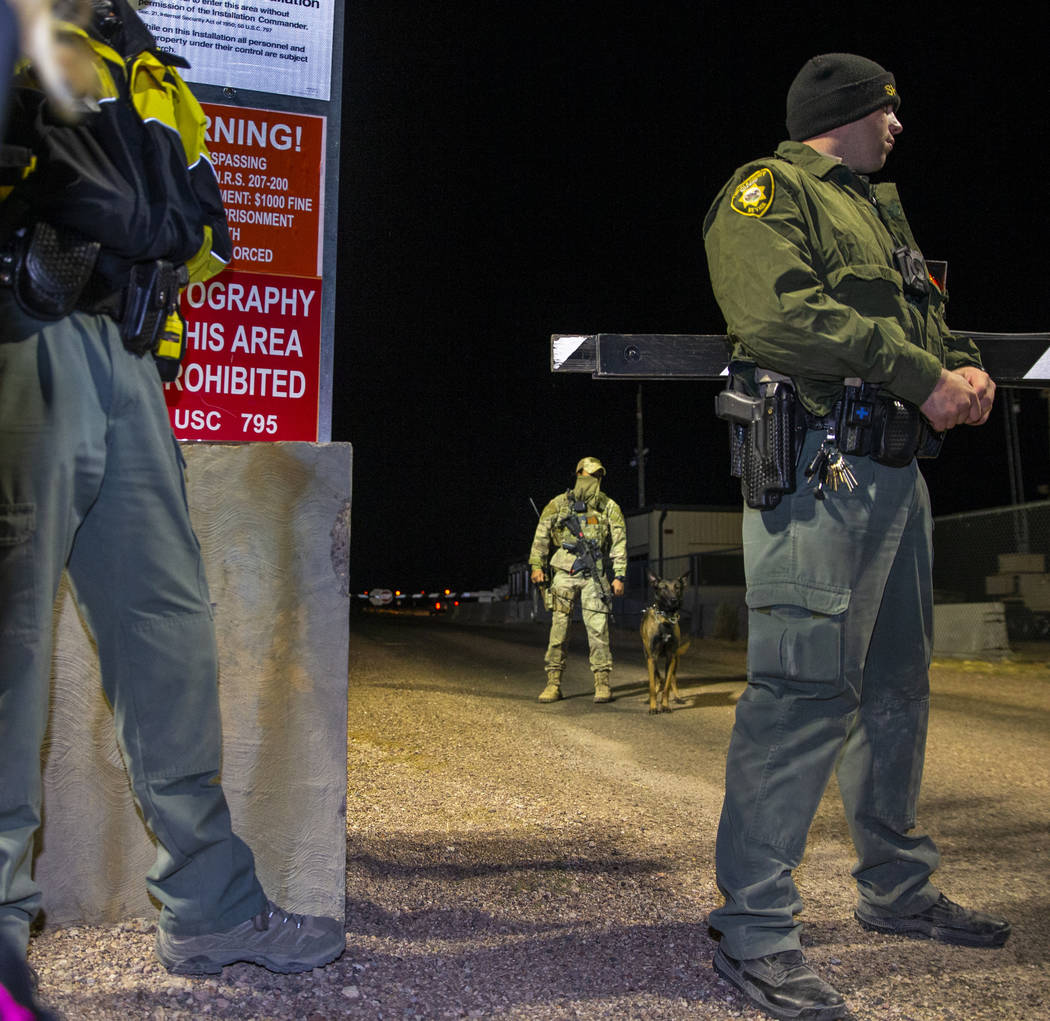 Security personnel patrol the back gate of Area 51 to monitor individuals there in homage to th ...