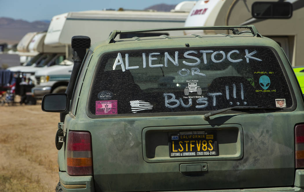 Sign on the rear window of a car during the Alienstock festival on Friday, Sept. 20, 2019 in Ra ...