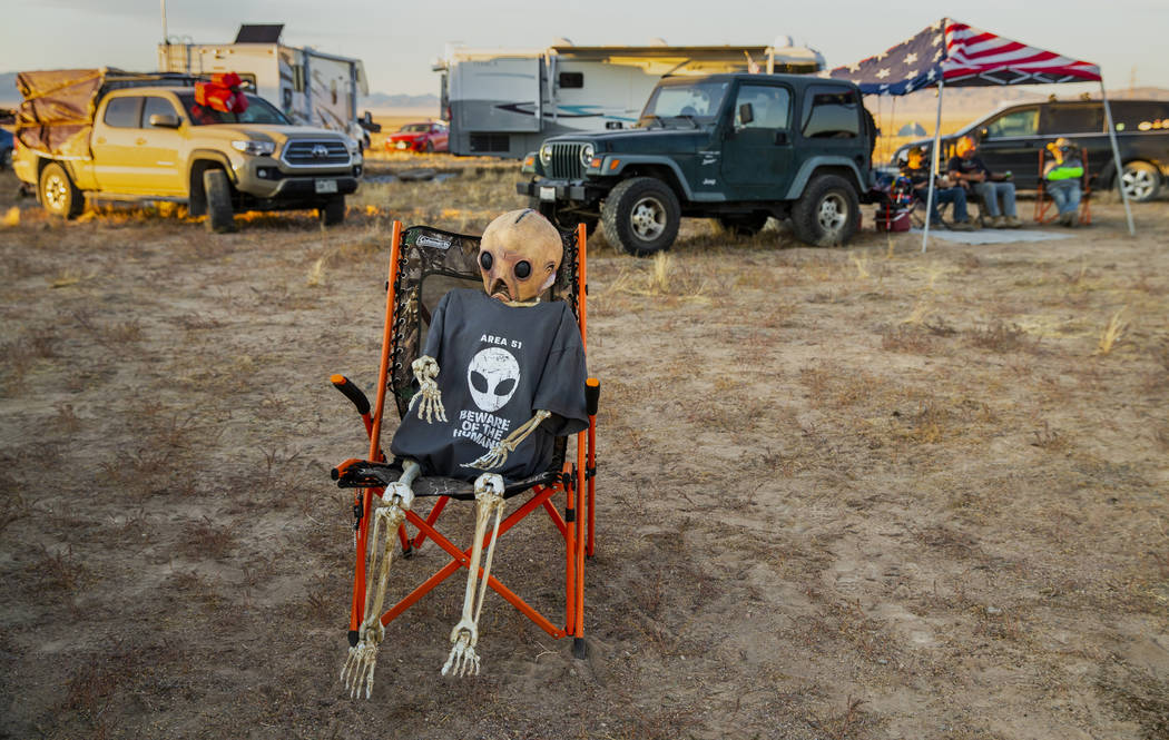 An alien relaxes in the off-site parking across from the Alienstock festival on Friday, Sept. 2 ...