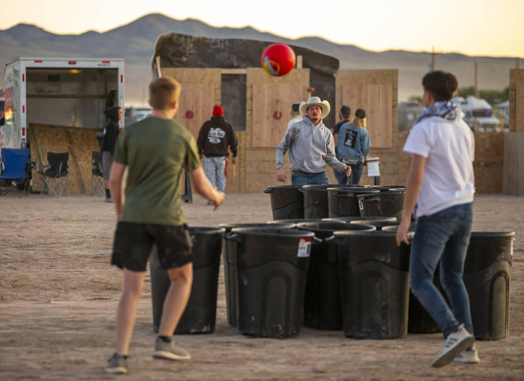 Festivalgoers play some trash can pong during the Alienstock festival on Friday, Sept. 20, 2019 ...
