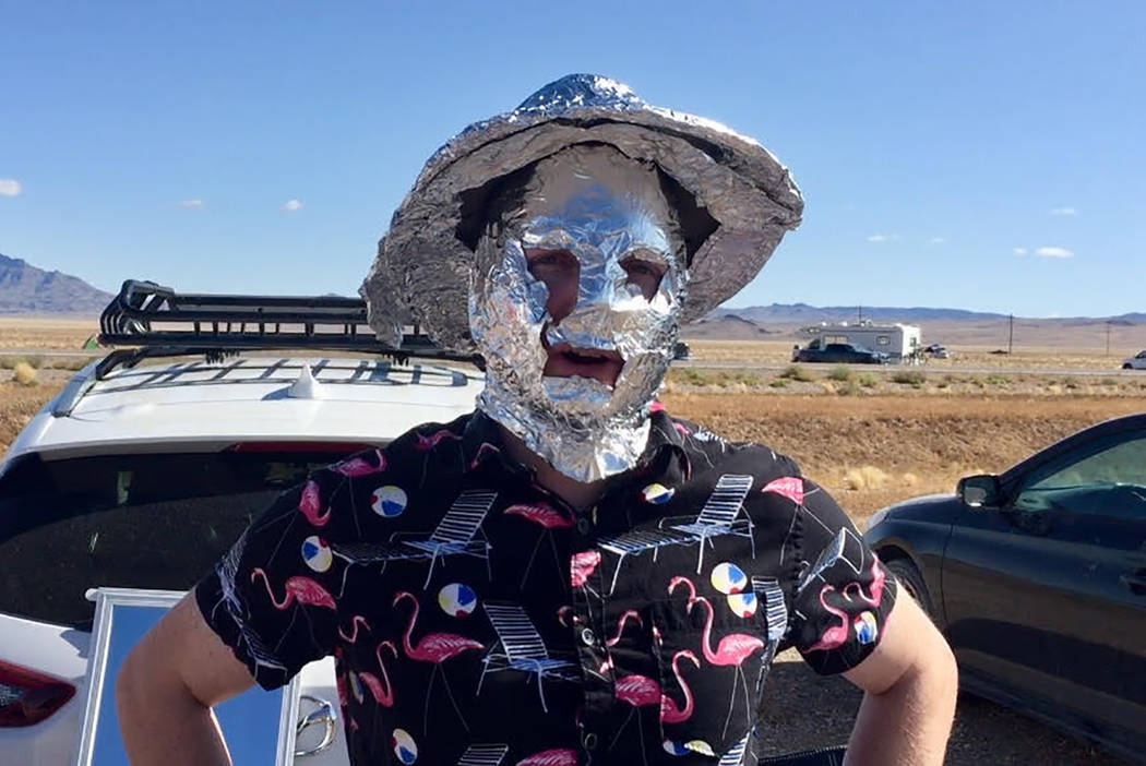 Chris Reid and his friend Justin Wainscott, both of Reno, are making free tin foil hats for tho ...