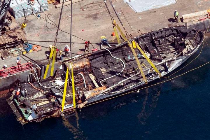 In a Sept. 12, 2019, file photo, the burned hull of the dive boat Conception is brought to the ...