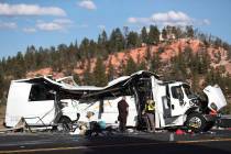 Authorities work the scene where at least four people were killed in a tour bus crash near Bryc ...