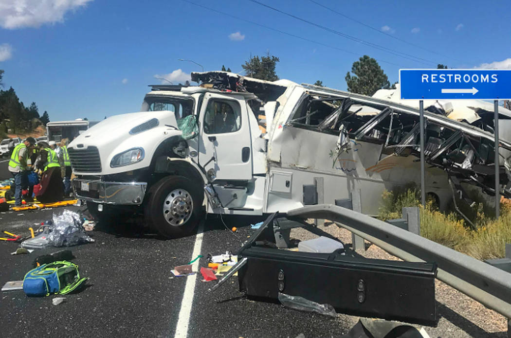 This photo released by the Garfield County Sheriff's Office shows a tour bus that was carrying ...