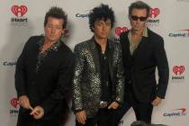 Tre Cool, Billie Joe Armstrong and Mike Dirnt of Green Day are shown on the red carpet at iHear ...