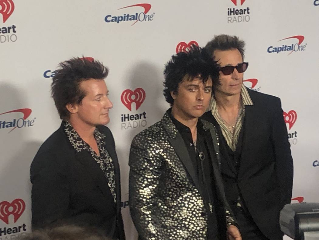 Tre Cool, Billie Joe Armstrong and Mike Dirnt of Green Day are shown on the red carpet at iHear ...