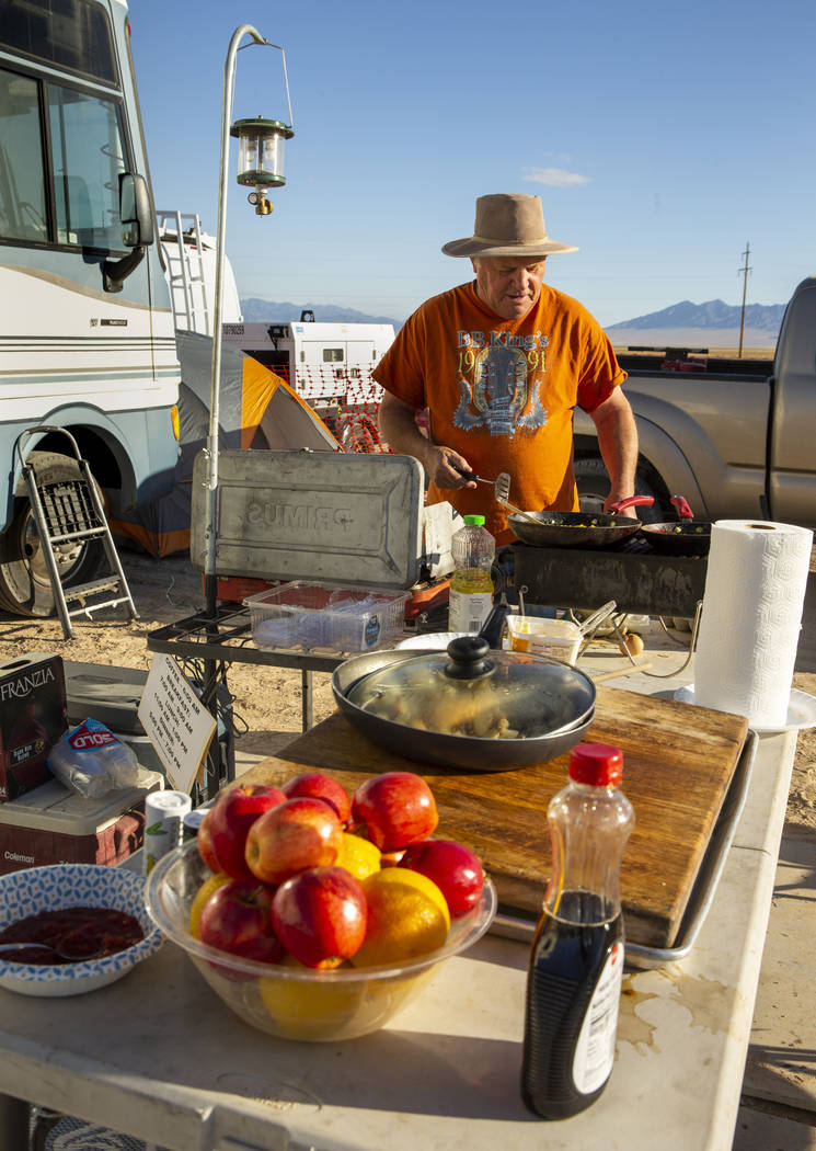 George Morrow cooks up breakfast for the stage construction crew as the start of the Alienstock ...