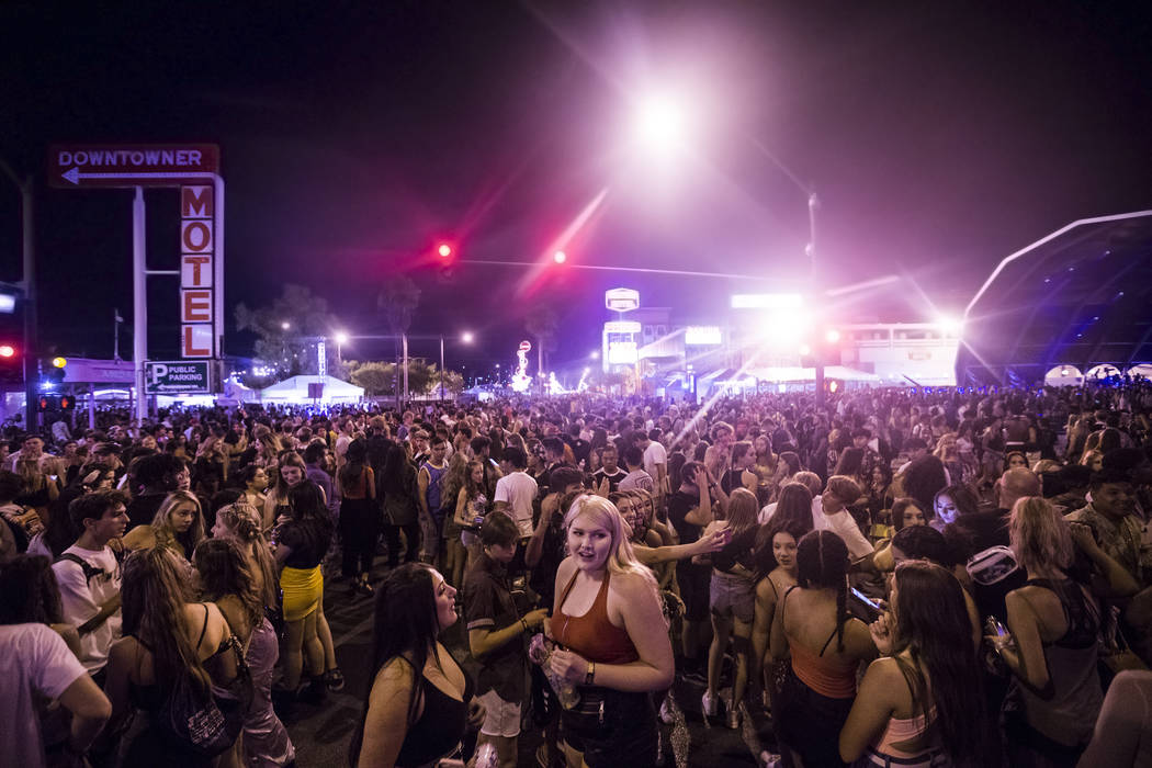 Festivalgoers pack the intersection of South 8th and Fremont streets during the first day of Li ...