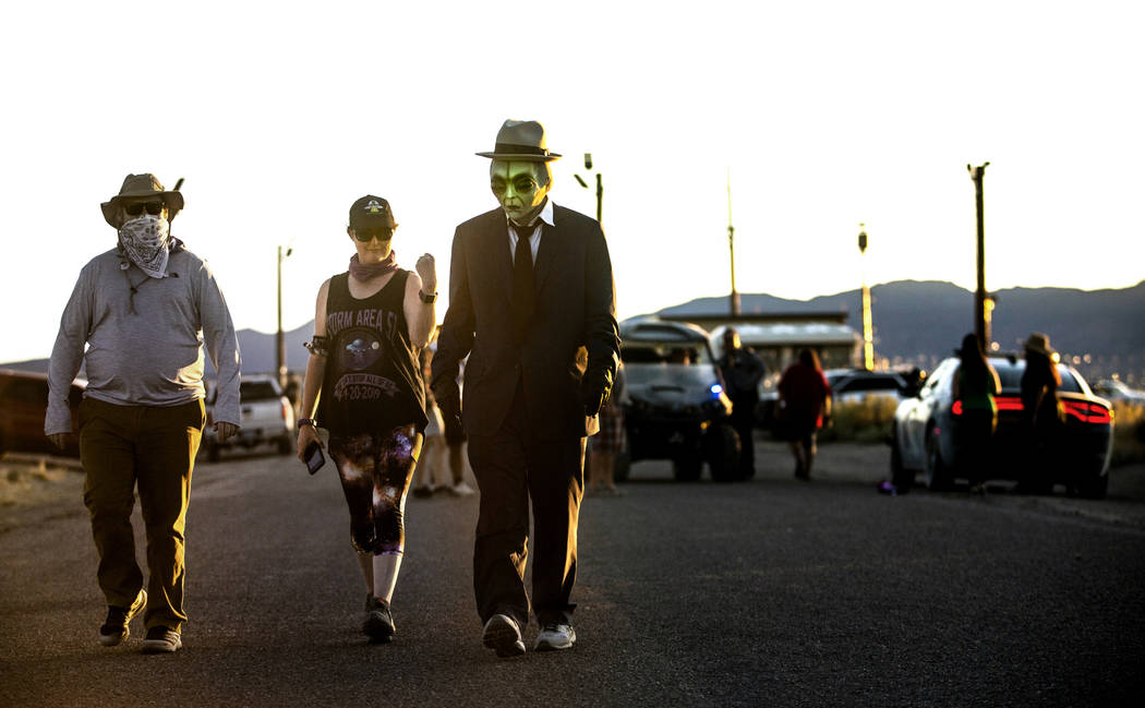 Visitors walk away from the back gate of Area 51 during the Alienstock festival on Saturday, Se ...