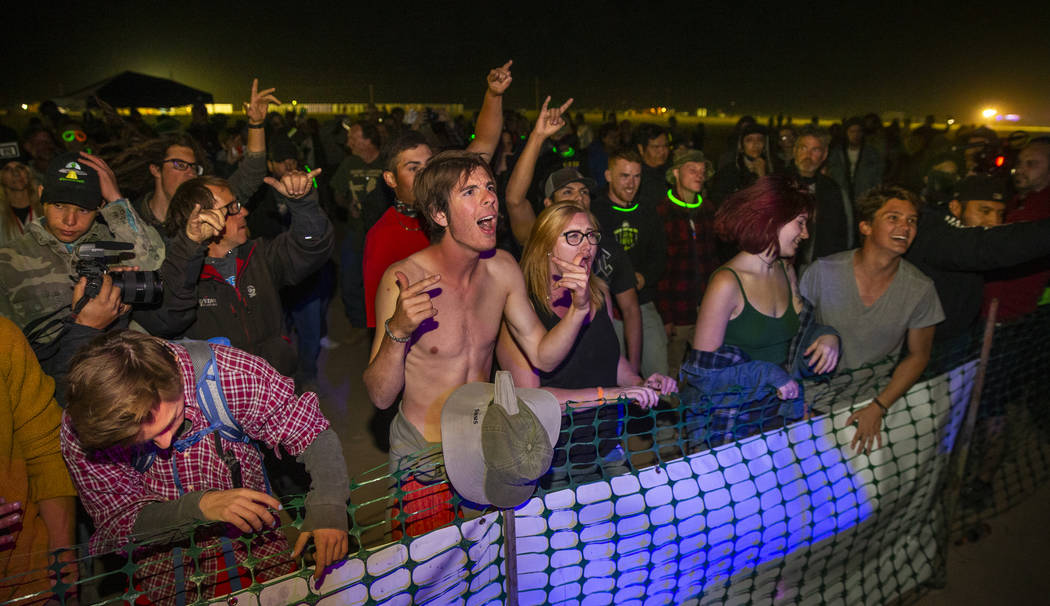 Festivilgoers rock to the band Speed of Light of Santa Monica at the main stage on night two of ...