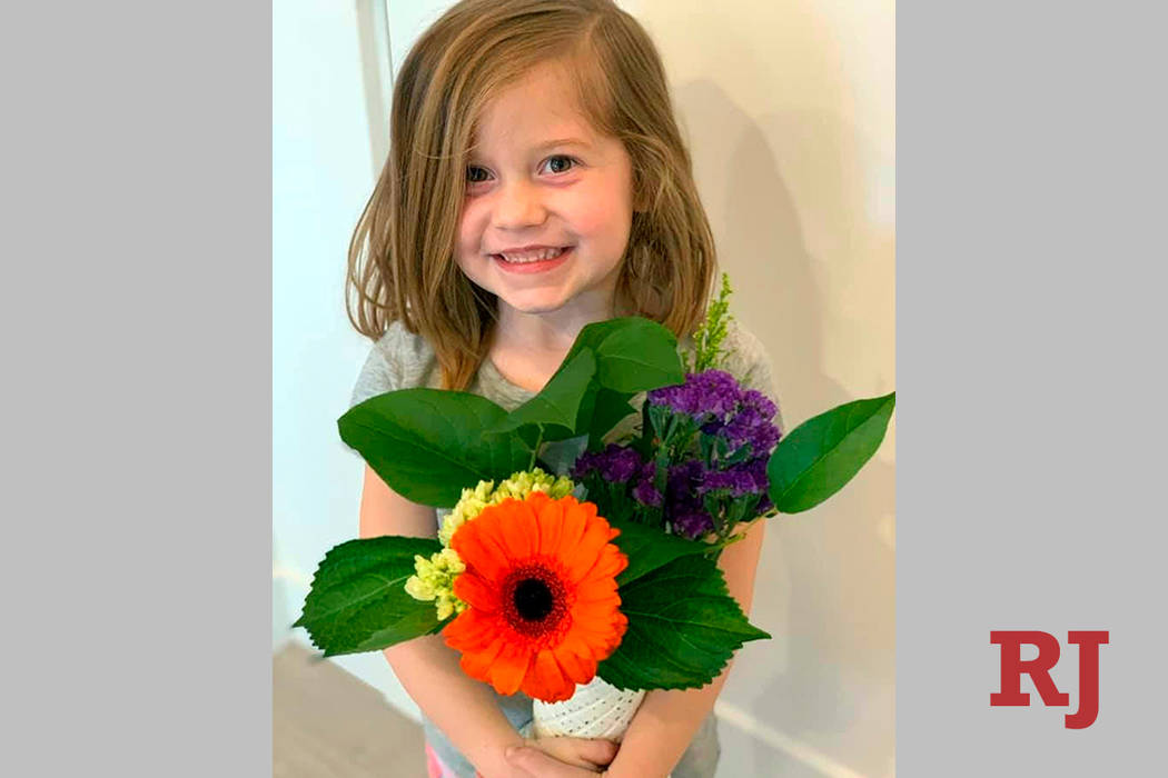 This Feb. 14, 2019 photo provided by her uncle, David Smith, shows Aria Hill posing with flower ...