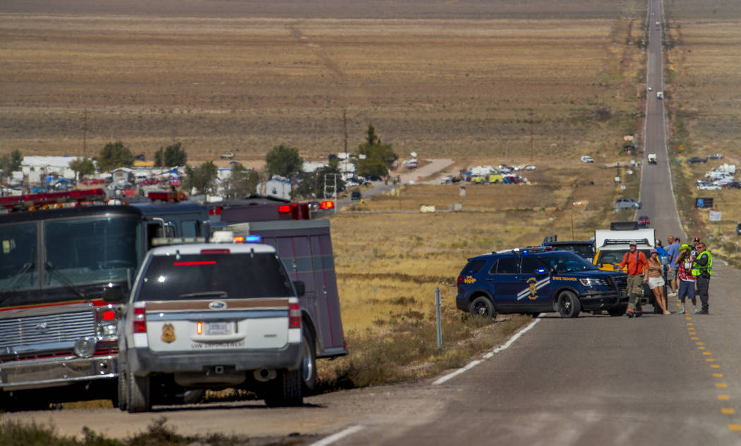 Emergency and medical personnel block off the Extraterrestrial Highway/State Route 375 for a po ...