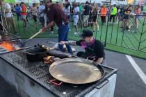 Mike Minor tends his fire at The Cookout on Friday. (Al Mancini/Las Vegas Review-Journal)
