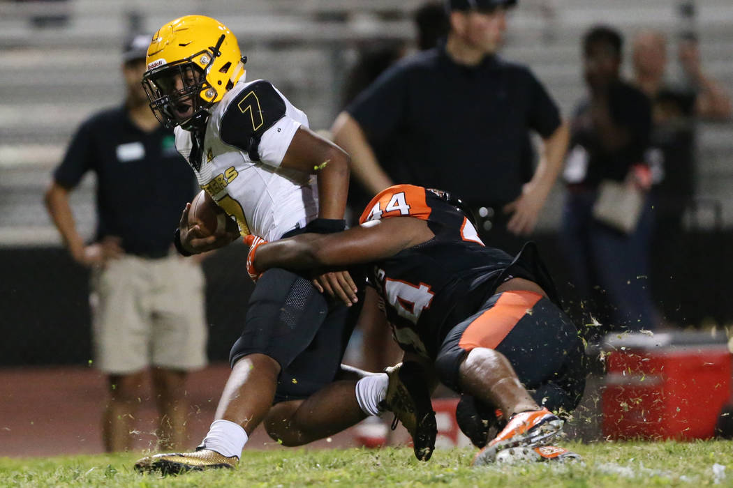 Clark's My'quel Johnson(7) is tackled by Chaparral's Robert Whitstone (44) in the second quarte ...