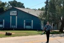 A Lancaster County Sheriff's deputy walks around the Old Skool Sports Bar and Grill, the scene ...