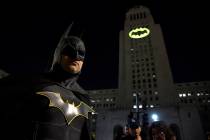 FILE - In this June 15, 2017 file photo, Tony Bradshaw, of Los Angeles, dressed as Batman, pose ...