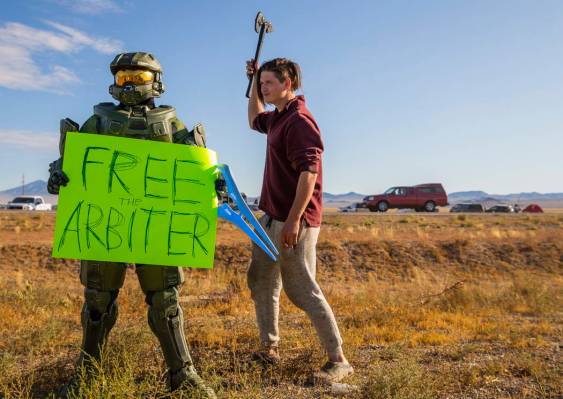 Spencer Smith of Louisiana, right, moves in close to a character from Halo during the Alienstoc ...