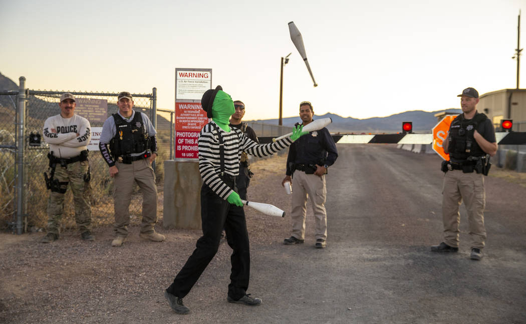 Scott Samford of Hollywood as an alien juggling mime entertains the security personnel at the b ...