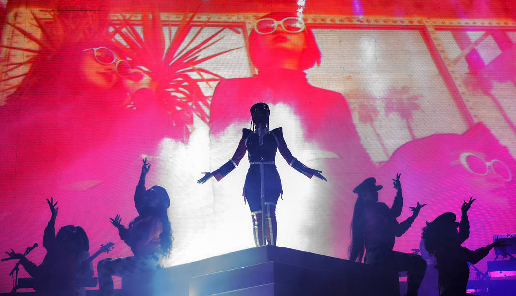 Janelle Monáe, middle, performs on the Bacardi Stage during the second day of Life is Beau ...