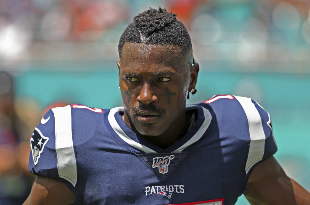 New England Patriots wide receiver Antonio Brown waits for the team's NFL football game against ...