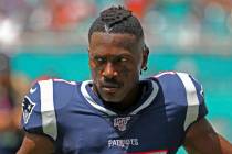 New England Patriots wide receiver Antonio Brown waits for the team's NFL football game against ...