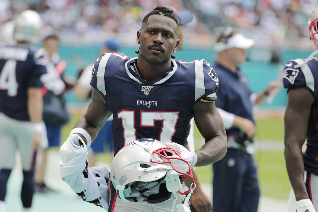 New England Patriots wide receiver Antonio Brown (17) stands on the sidelines during the first ...