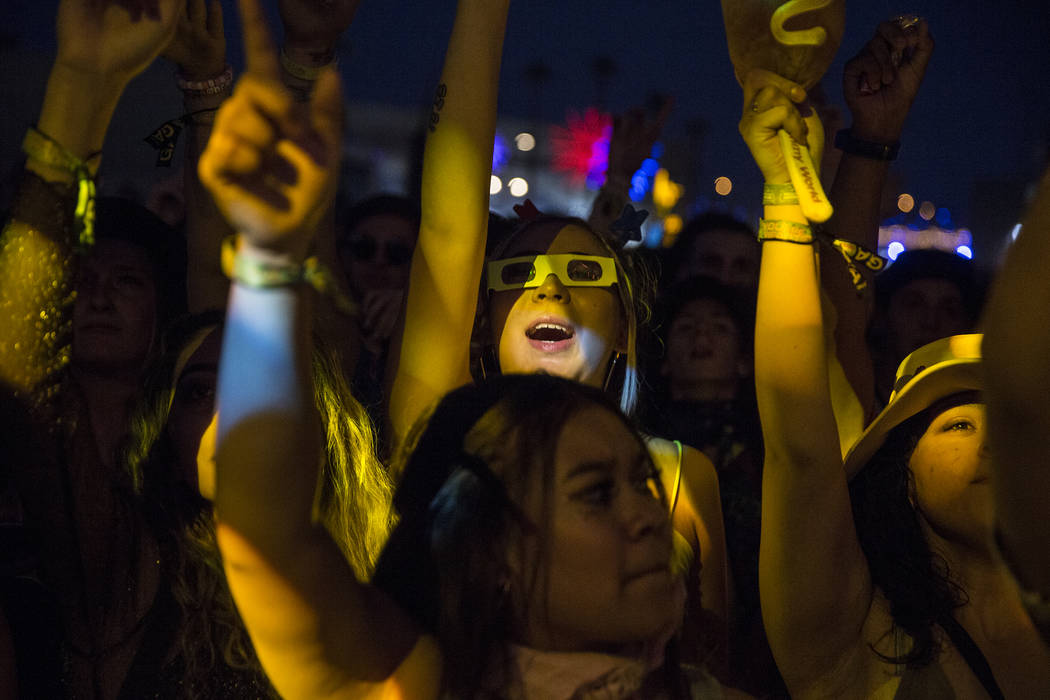 Fans cheer for Taylor Bennett, brother of Chance the Rapper, at the Huntridge Stage during the ...