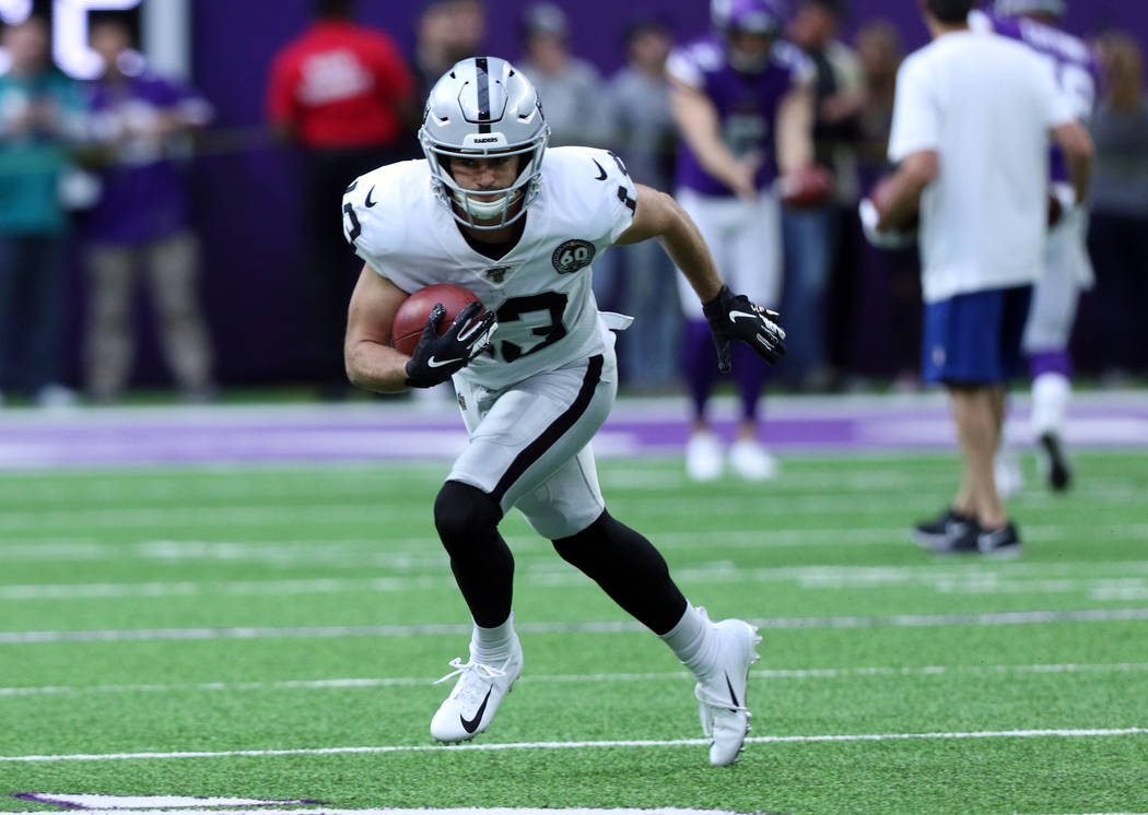 Oakland Raiders wide receiver Hunter Renfrow (13) runs through a drill prior to the start of an ...