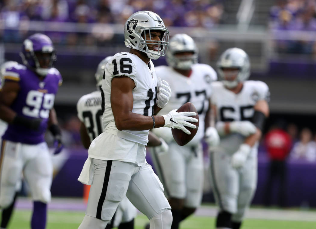Oakland Raiders wide receiver Tyrell Williams (16) holds on the football after making a catch d ...