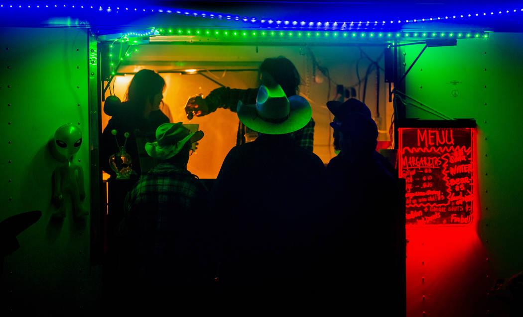 Festivalgoers stop by for a fresh margarita from Pioche vendors during the Alienstock festival ...