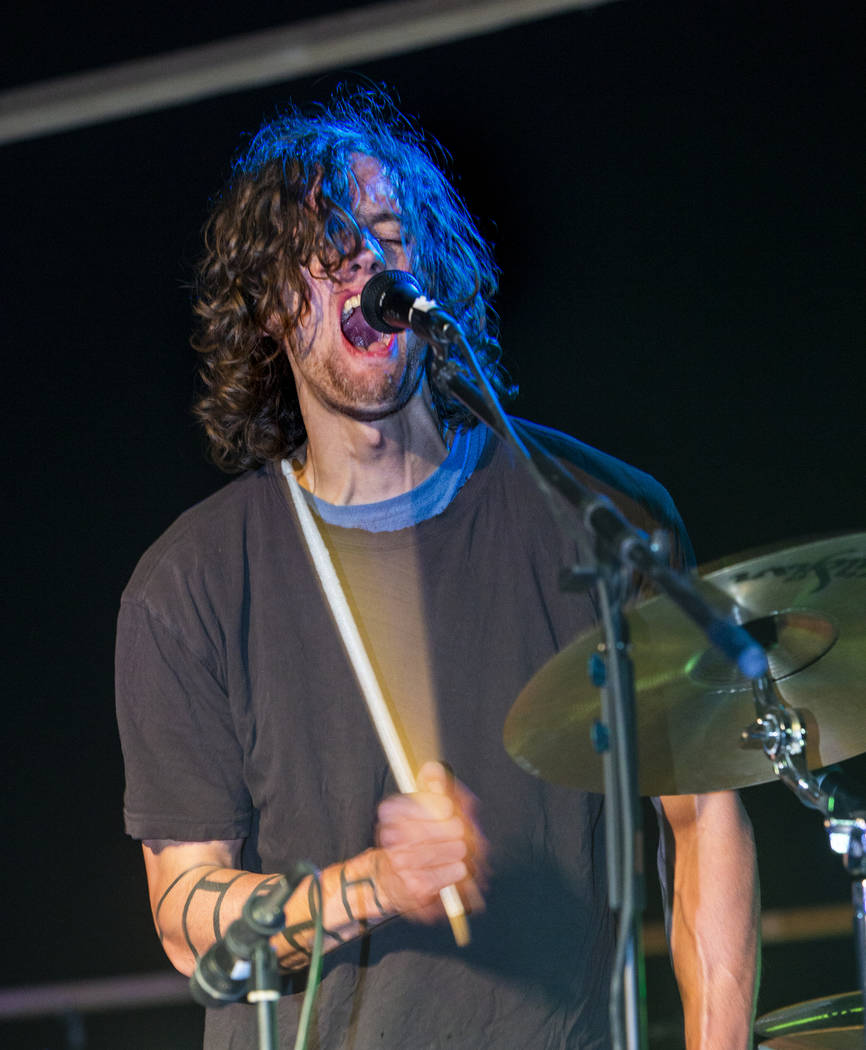 Scott Simpson of Dog Lord belts out his last song of the night before festivalgoers during the ...