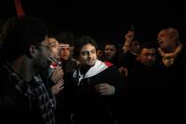 FILE - In this Feb. 10, 2011 file photo, Egyptian Wael Ghonim, center, walks into Tahrir Squar ...