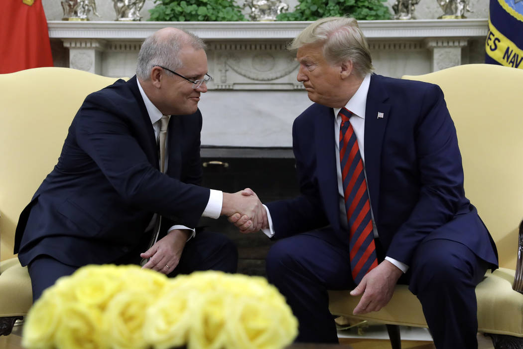 President Donald Trump shakes hands with Australian Prime Minister Scott Morrison in the Oval O ...