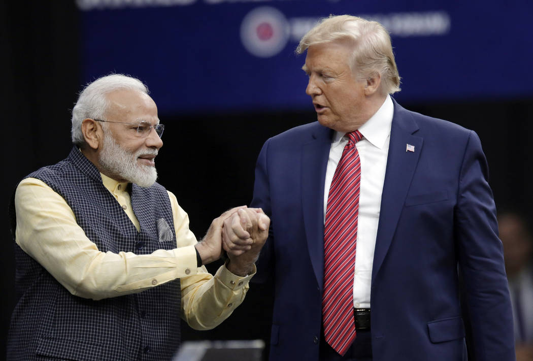 Prime Minister Narendra Modi and President Donald Trump shake hands after introductions during ...