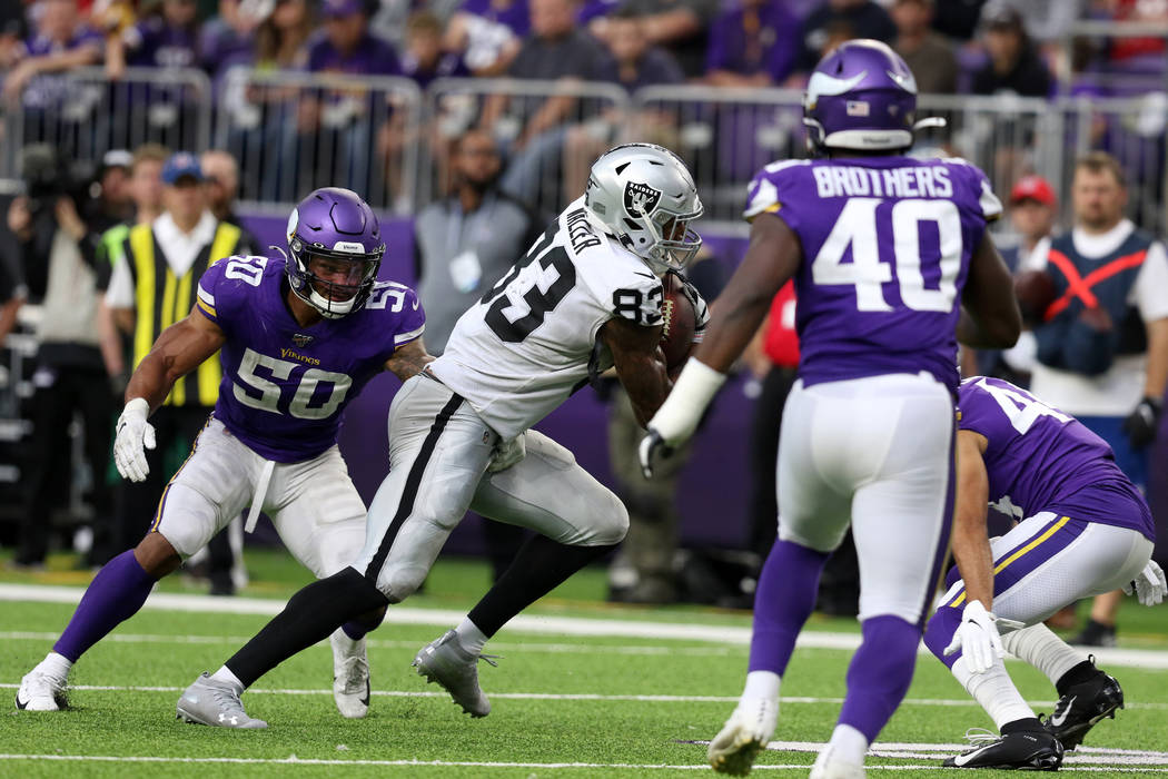 Oakland Raiders tight end Darren Waller (83) sheds a tackle from Minnesota Vikings linebacker E ...