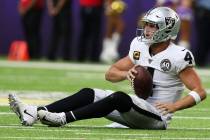 Oakland Raiders quarterback Derek Carr (4) remains on the field after being sacked during the f ...