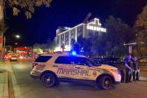 A large law enforcement presence is visible Thursday, Aug. 22, 2019, in downtown Las Vegas, at ...