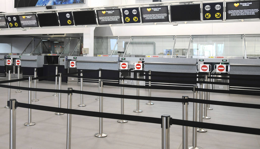 General view of the deserted Thomas Cook check-in counters at Birmingham airport in Birmingham, ...
