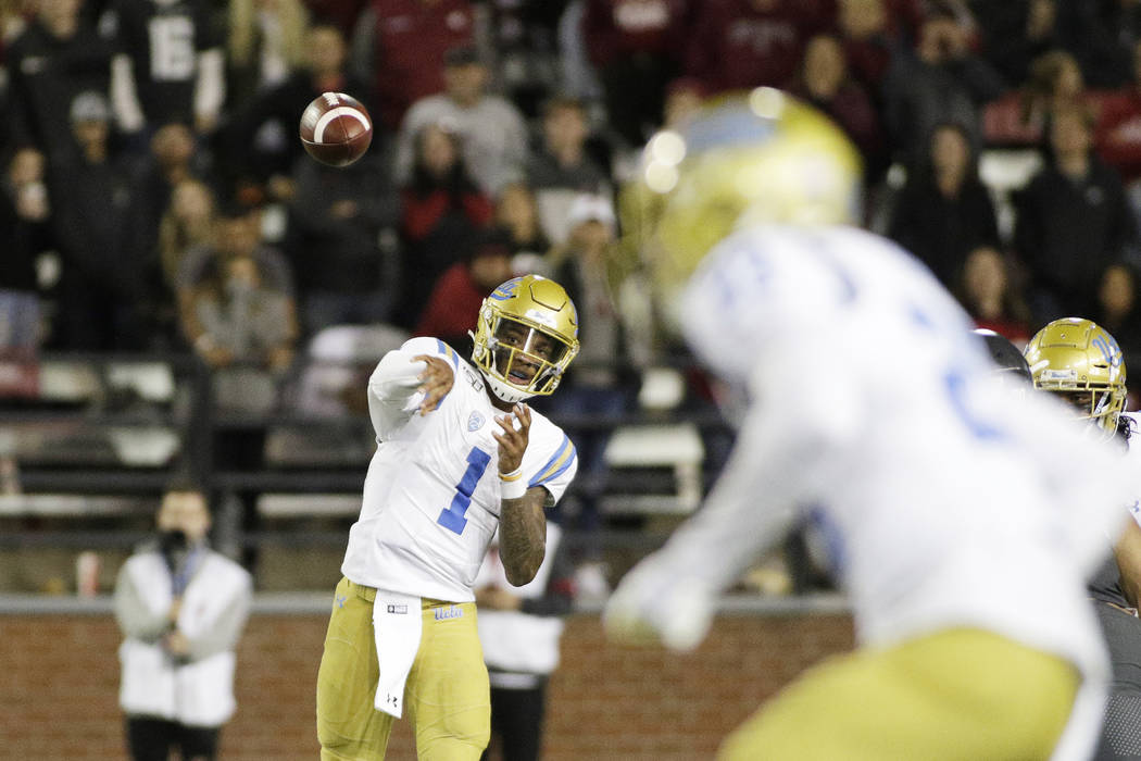 UCLA quarterback Dorian Thompson-Robinson (1) throws a pass during the second half of an NCAA c ...