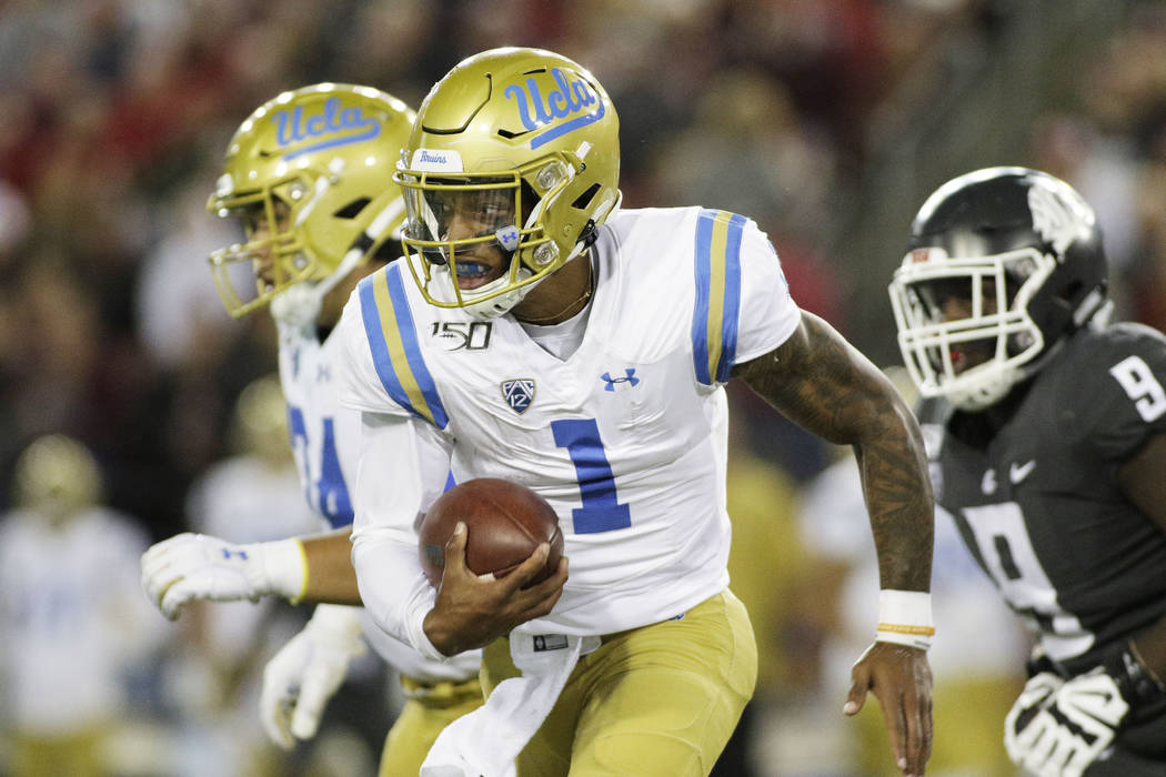 UCLA quarterback Dorian Thompson-Robinson (1) runs with the ball during the second half of an N ...