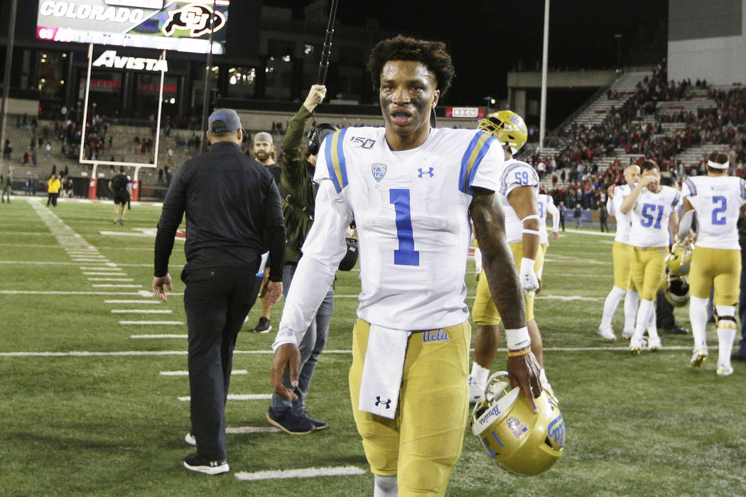 UCLA quarterback Dorian Thompson-Robinson (1) walks off the field after an NCAA college footbal ...