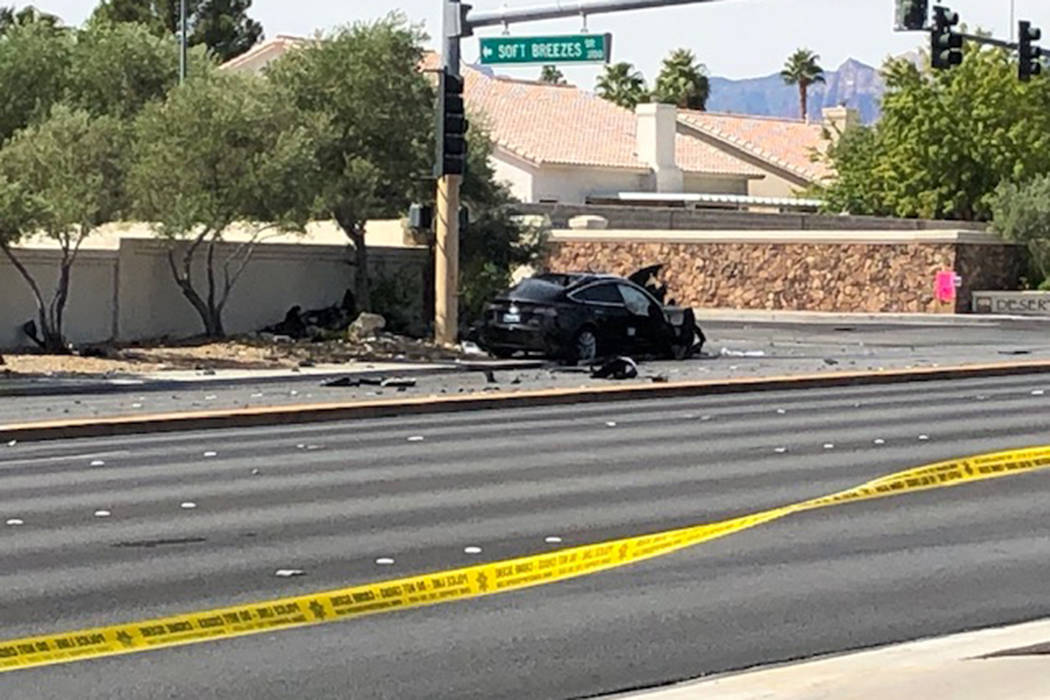 Police investigate a fatal crash near West Cheyenne Avenue and Buffalo Drive in Las Vegas, Sund ...