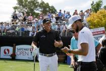 Phil Mickelson, left, talks with Stephen Curry on the first tee of the Silverado Resort North C ...