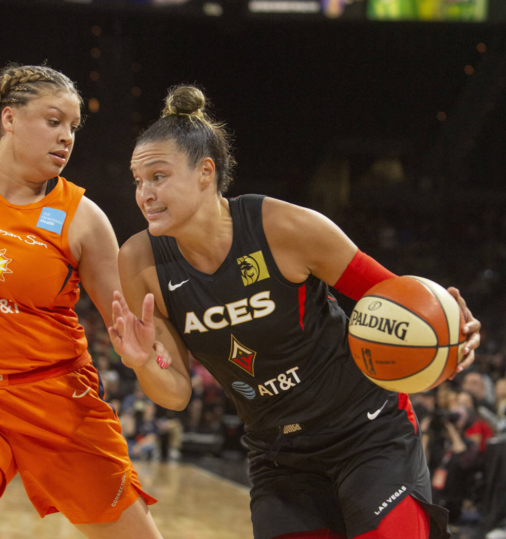 Las Vegas Aces guard Kayla McBride (21) runs to the hoop against Connecticut Sun guard Rachel B ...