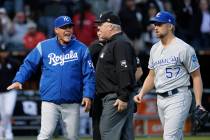 Kansas City Royals manager Ned Yost, left, appeals to umpire crew chief Bill Miller, center, af ...