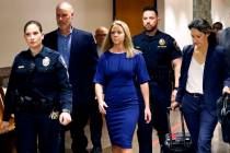 Former Dallas police officer Amber Guyger, center, arrives for the first day of her murder tria ...