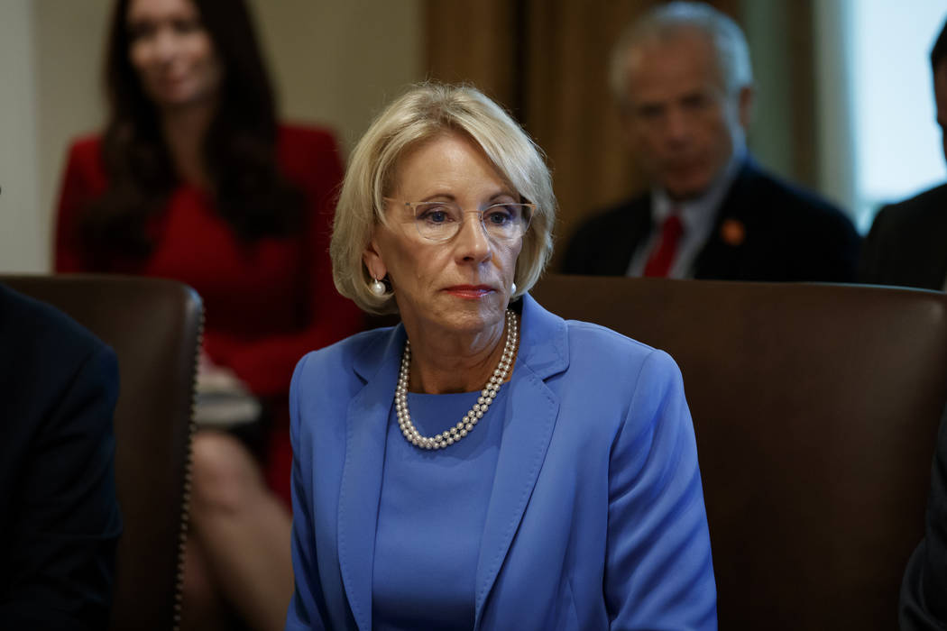 FILE - In this July 16, 2019, file photo, Education Secretary Betsy DeVos listens during a Cabi ...